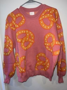Pink Crewneck Sweater with Orange Pretzel Motif